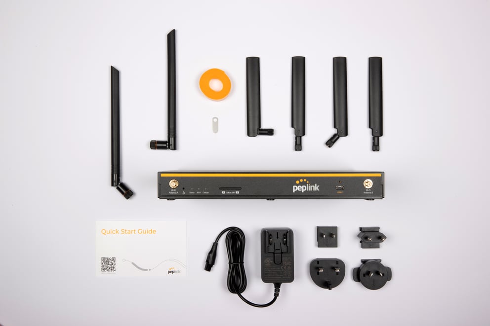 Peplink B One 5G package contents - router, antennas, power supply