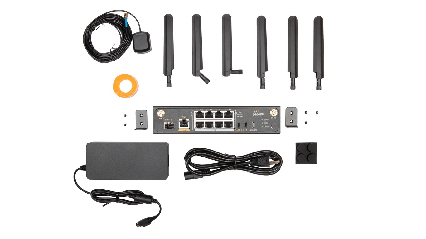 Peplink Balance 310 5G box contents: router, antennas, power supply, rack ears